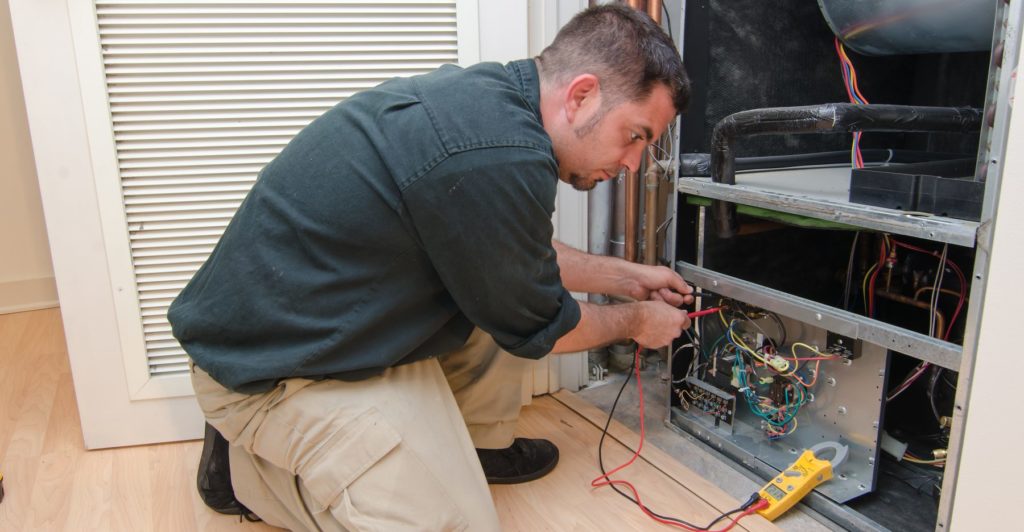 Technician performing electrical work