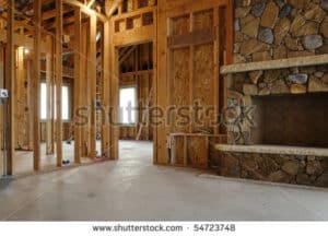 stock-photo-interior-view-of-a-new-home-under-construction-a-stone-fireplace-has-been-installed-horizontal-54723748