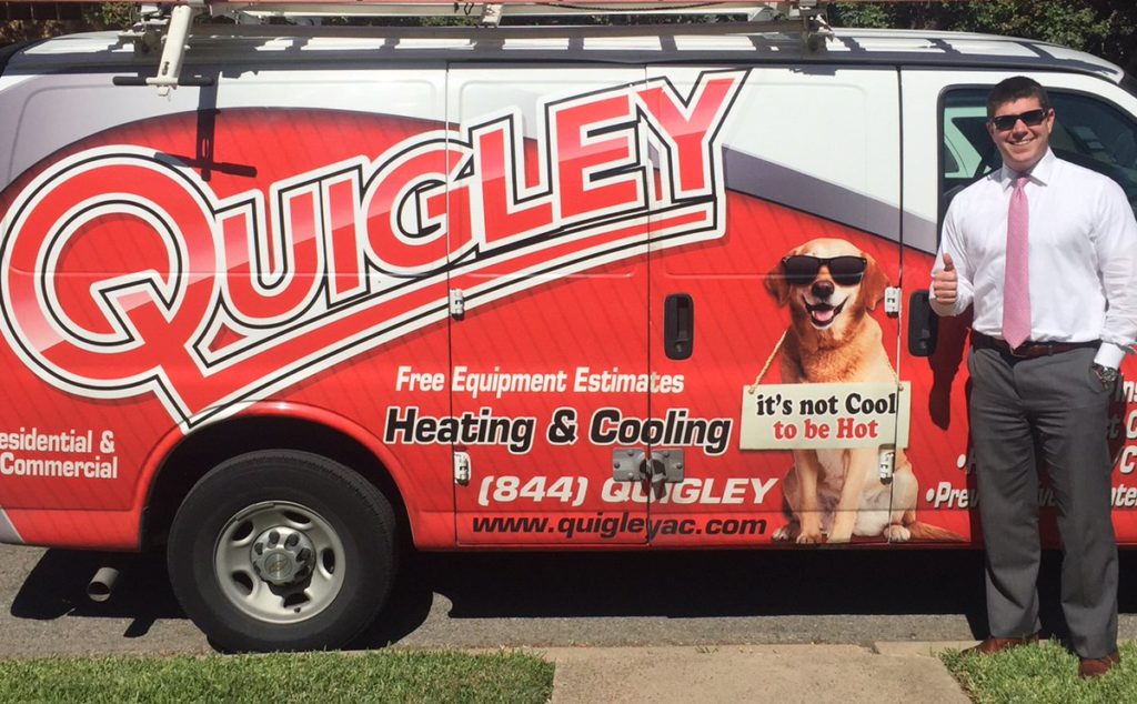 Man with thumbs up next to Quigley AC van